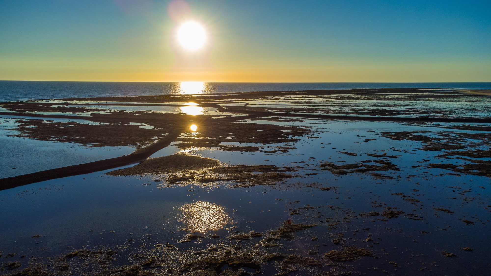 The corrales of Rota at sunset with the tide out